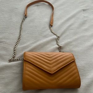 Forever 21 mustard colored handbag with strap.